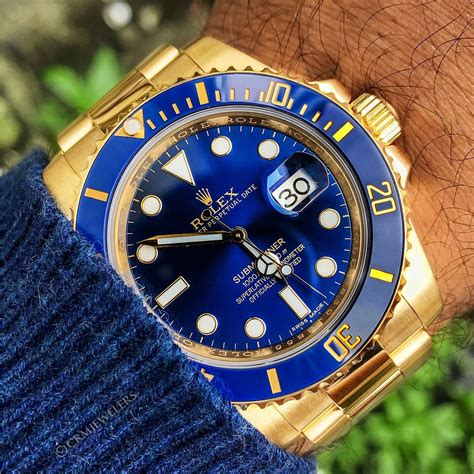 gold rolex submariner blue face.